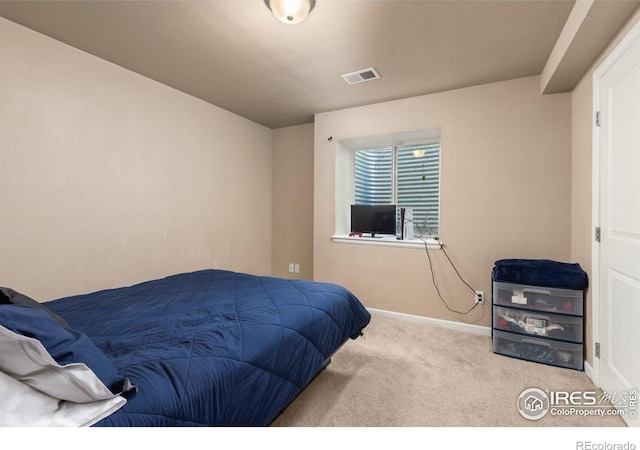 bedroom with carpet flooring and baseboards