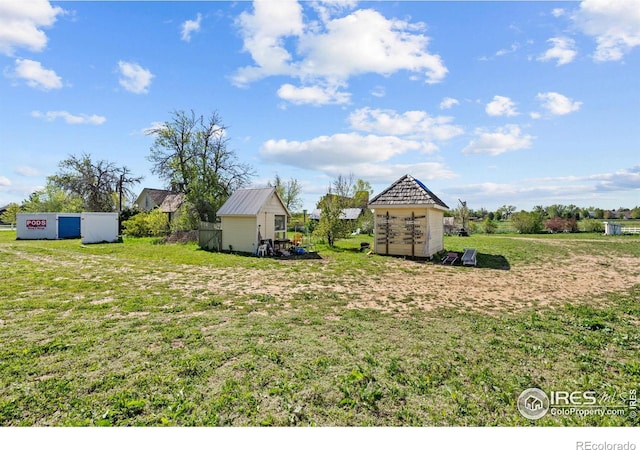 1341 N 95th St, Lafayette, CO 80026 - view of yard featuring a storage unit and an outbuilding