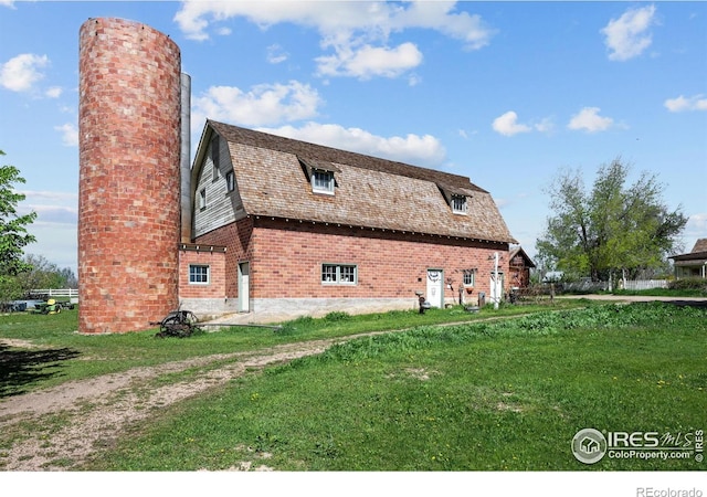 1341 N 95th St, Lafayette, CO 80026 - view of side of home featuring a gambrel roof, a chimney, and a barn