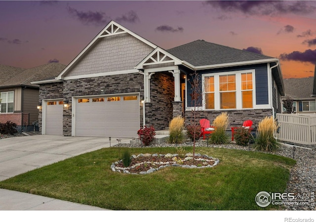 craftsman house featuring a garage, stone siding, and concrete driveway