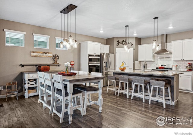 dining space featuring dark wood-style floors and recessed lighting