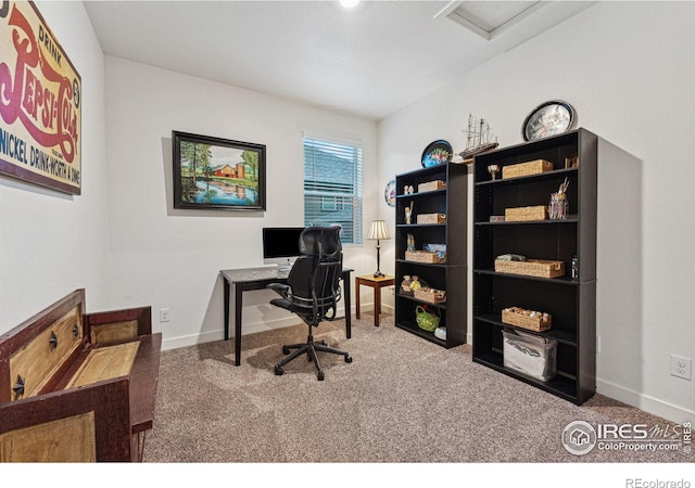 carpeted home office with baseboards