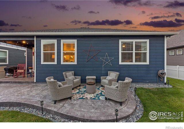 rear view of property with a patio area, outdoor lounge area, and fence