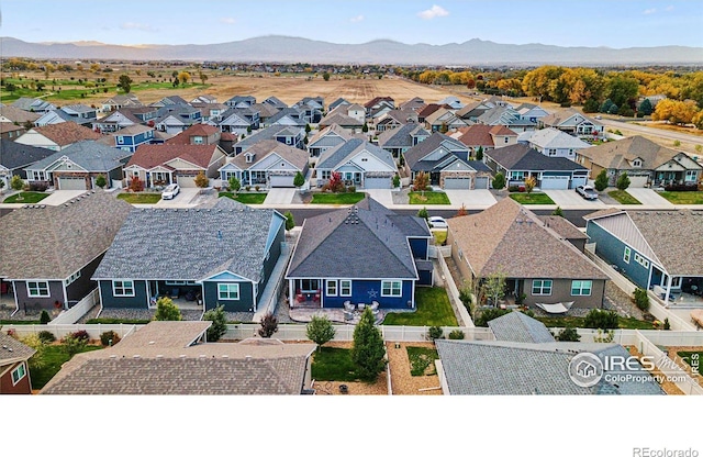 aerial view of residential area with a mountainous background