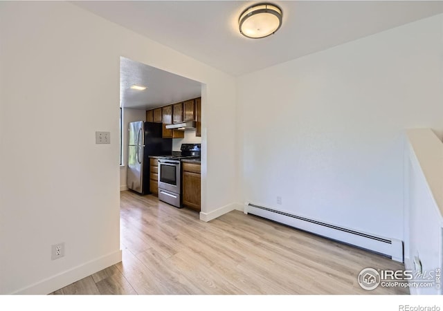 3363 Oneal Pkwy Unit 36, Boulder, CO 80301 - kitchen featuring stainless steel appliances, baseboard heating, under cabinet range hood, light wood finished floors, and baseboards