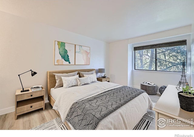 3363 Oneal Pkwy Unit 36, Boulder, CO 80301 - bedroom featuring light wood finished floors and baseboards