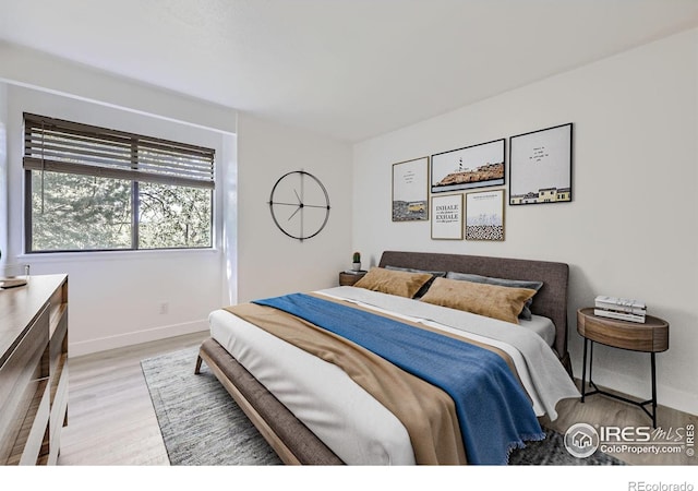 3363 Oneal Pkwy Unit 36, Boulder, CO 80301 - bedroom featuring wood finished floors and baseboards