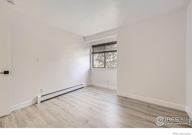 3363 Oneal Pkwy Unit 36, Boulder, CO 80301 - unfurnished room with baseboard heating, wood finished floors, and baseboards