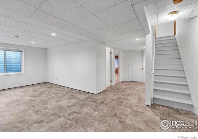 1606 Iris St, Broomfield, CO 80020 - basement with a drop ceiling, stairs, recessed lighting, baseboards, and tile patterned floors