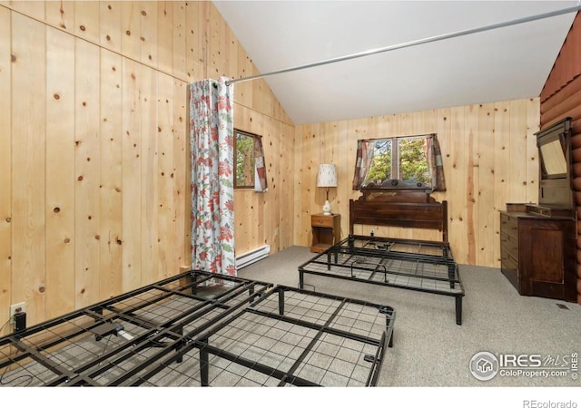 bedroom featuring a baseboard heating unit, wooden walls, carpet floors, and lofted ceiling