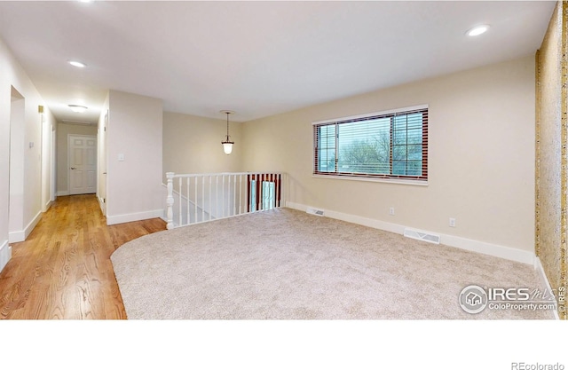 8351 Ralph Ln, Denver, CO 80221 - unfurnished room with light wood-style flooring, baseboards, and recessed lighting