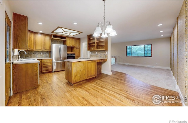 8351 Ralph Ln, Denver, CO 80221 - kitchen featuring stainless steel appliances, a sink, open shelves, open floor plan, and light countertops