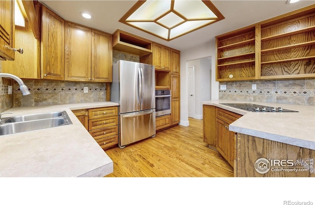 8351 Ralph Ln, Denver, CO 80221 - kitchen with open shelves, appliances with stainless steel finishes, a sink, tasteful backsplash, and light wood-type flooring