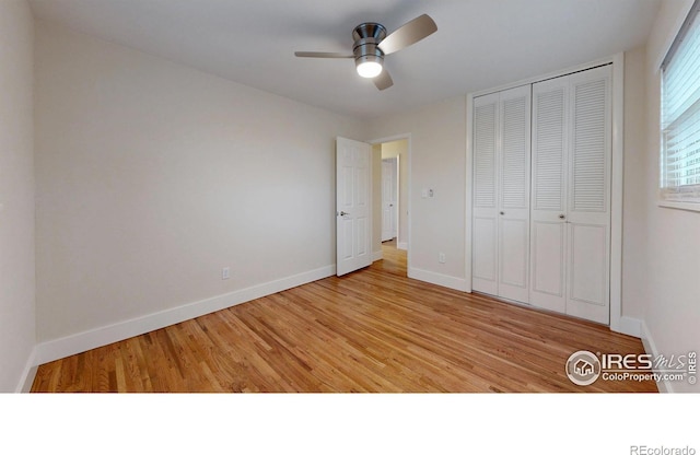 8351 Ralph Ln, Denver, CO 80221 - unfurnished bedroom featuring wood finished floors, baseboards, a closet, and ceiling fan