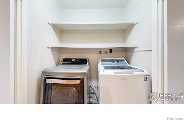 8351 Ralph Ln, Denver, CO 80221 - clothes washing area featuring independent washer and dryer