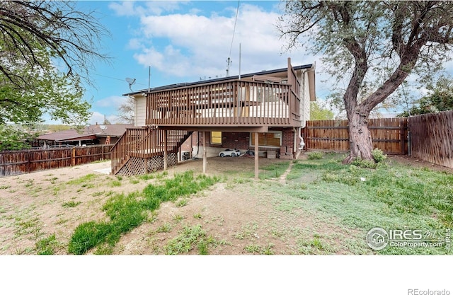 8351 Ralph Ln, Denver, CO 80221 - back of property with stairway, a wooden deck, and a fenced backyard