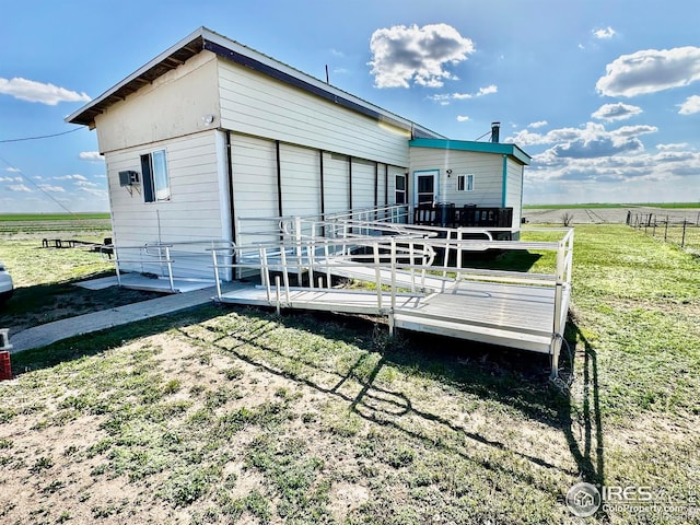 45908 County Road 39, Otis, CO 80743 - back of property featuring a deck and a view of rural / pastoral area