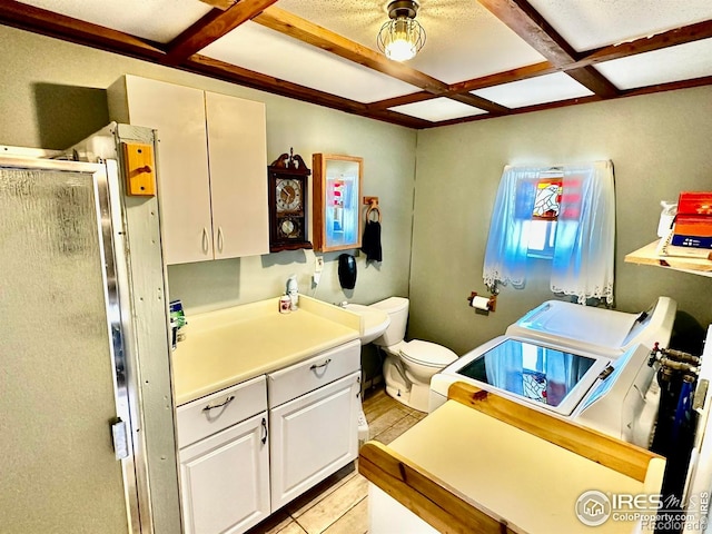 45908 County Road 39, Otis, CO 80743 - bathroom with coffered ceiling, separate washer and dryer, beamed ceiling, a stall shower, and toilet