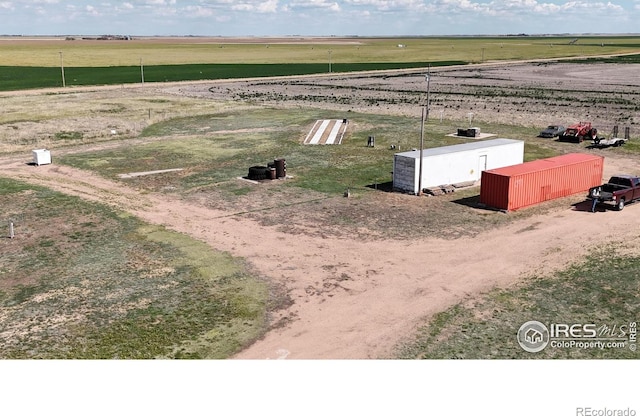 45908 County Road 39, Otis, CO 80743 - view of storm shelter featuring a view of countryside, a pole building, and an outdoor structure