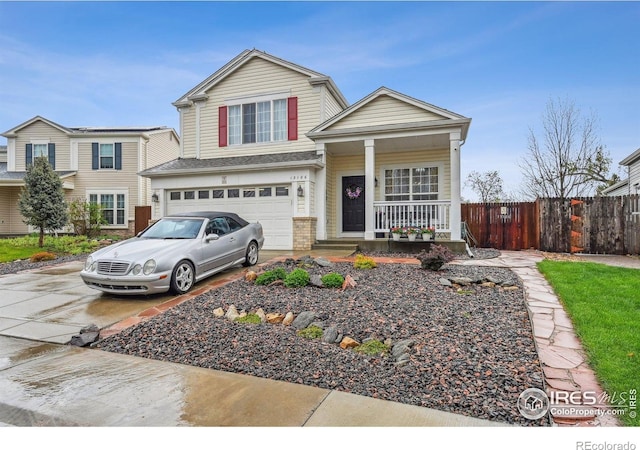 13106 Elizabeth St, Thornton, CO 80241 - view of front of property with a porch, fence, concrete driveway, and a garage