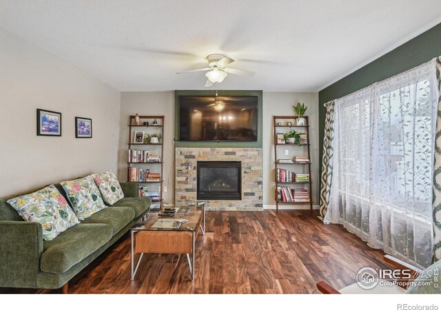 13106 Elizabeth St, Thornton, CO 80241 - living area with a fireplace, wood finished floors, ceiling fan, and built in shelves
