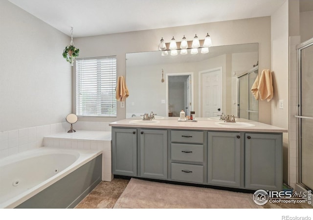 13106 Elizabeth St, Thornton, CO 80241 - full bathroom with a shower stall, double vanity, a tub with jets, and tile patterned floors