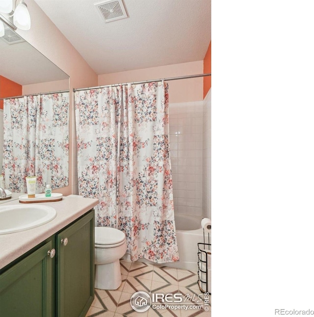 13106 Elizabeth St, Thornton, CO 80241 - bathroom with vanity, toilet, tile patterned flooring, and shower / bath combo