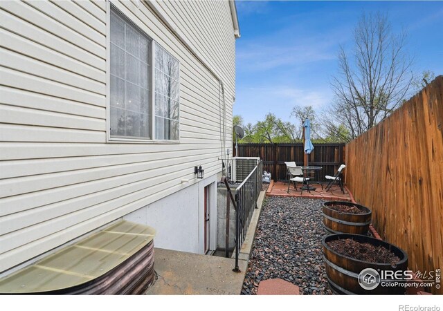 13106 Elizabeth St, Thornton, CO 80241 - view of home's exterior with a fenced backyard and a patio area