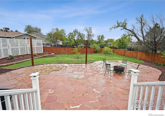 13106 Elizabeth St, Thornton, CO 80241 - view of patio with an outdoor fire pit