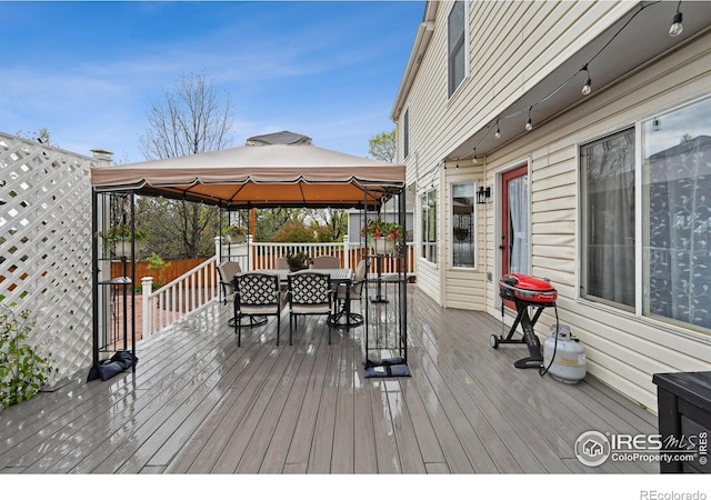13106 Elizabeth St, Thornton, CO 80241 - wooden terrace featuring a gazebo and outdoor dining space