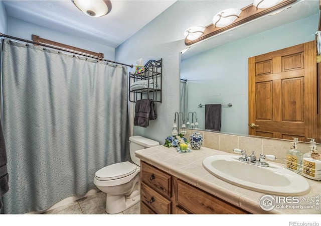 117 Mount Sherman Ct, Livermore, CO 80536 - full bath with vanity, toilet, tile patterned floors, and a shower with shower curtain