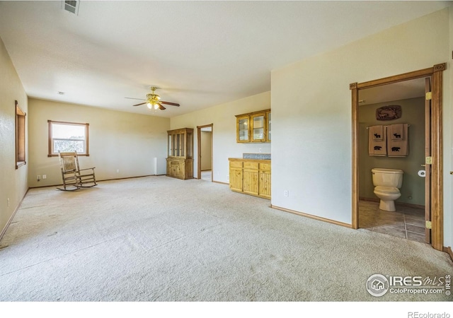 117 Mount Sherman Ct, Livermore, CO 80536 - unfurnished living room featuring light carpet, baseboards, and a ceiling fan