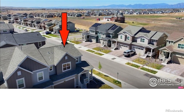 700 Lillibrook Pl, Erie, CO 80026 - aerial view of residential area with mountains