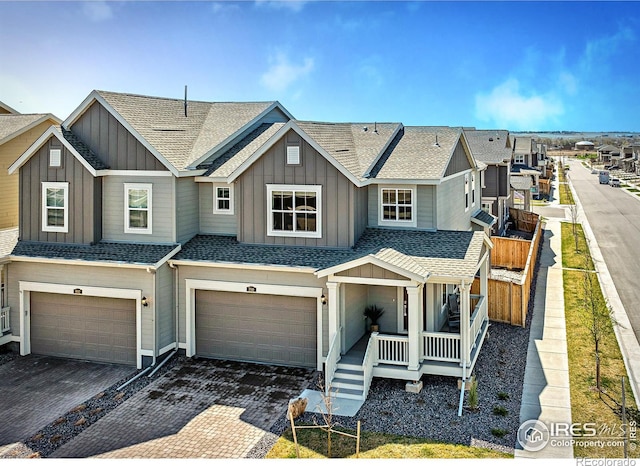 700 Lillibrook Pl, Erie, CO 80026 - townhome / multi-family property with board and batten siding, an attached garage, covered porch, and a shingled roof