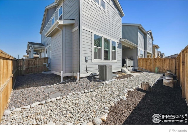 700 Lillibrook Pl, Erie, CO 80026 - view of property exterior with central AC unit and a fenced backyard