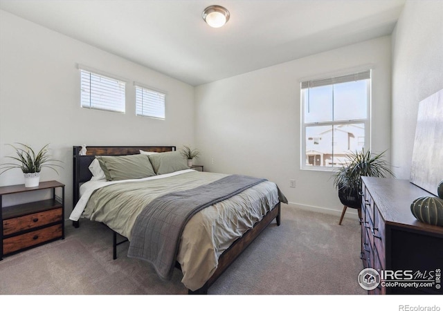 700 Lillibrook Pl, Erie, CO 80026 - carpeted bedroom featuring baseboards