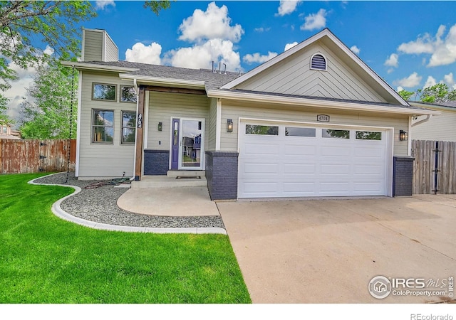 view of front of property with a chimney, brick siding, concrete driveway, and an attached garage
