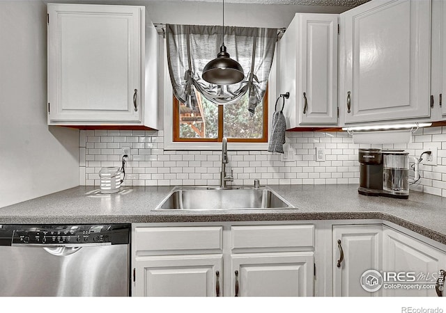 kitchen with dishwasher, a sink, white cabinetry, and tasteful backsplash