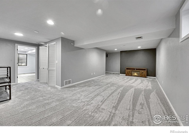 basement with carpet, recessed lighting, and baseboards