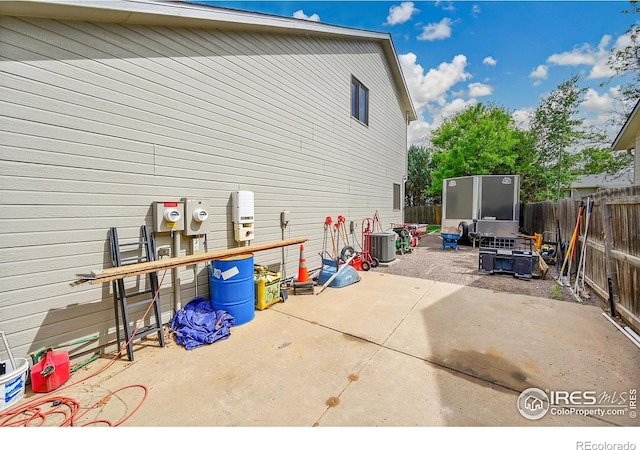 view of patio featuring cooling unit and a fenced backyard