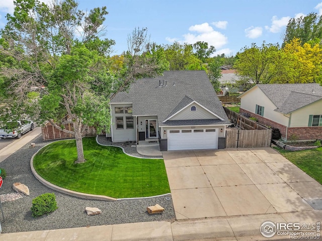 view of front of property featuring a shingled roof, a garage, and concrete driveway
