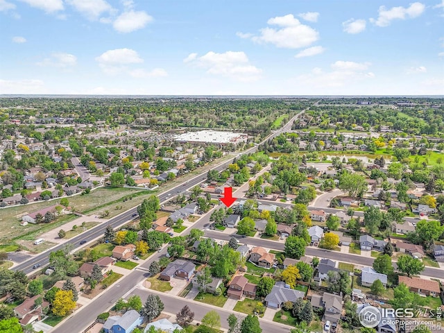 aerial view of property's location with nearby suburban area