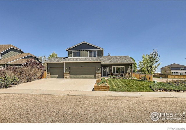 6601 Viburnum St, Wellington, CO 80549 - view of front of property featuring stone siding, driveway, an attached garage, and roof with shingles