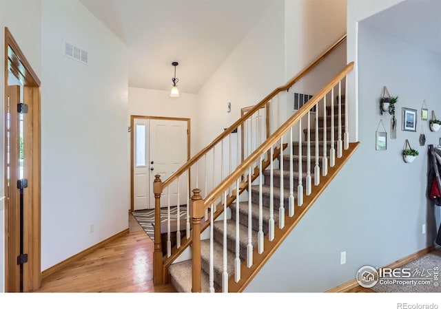 6601 Viburnum St, Wellington, CO 80549 - staircase featuring wood finished floors and baseboards