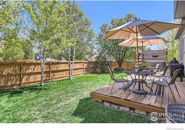 6601 Viburnum St, Wellington, CO 80549 - view of yard with a deck and outdoor dining area