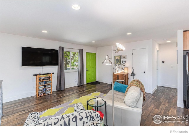 2310 44th Ave, Greeley, CO 80634 - living room with wood finished floors, recessed lighting, and baseboards