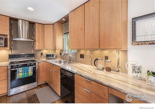 2310 44th Ave, Greeley, CO 80634 - kitchen featuring gas range, dishwasher, wall chimney exhaust hood, a sink, and dark wood-style flooring