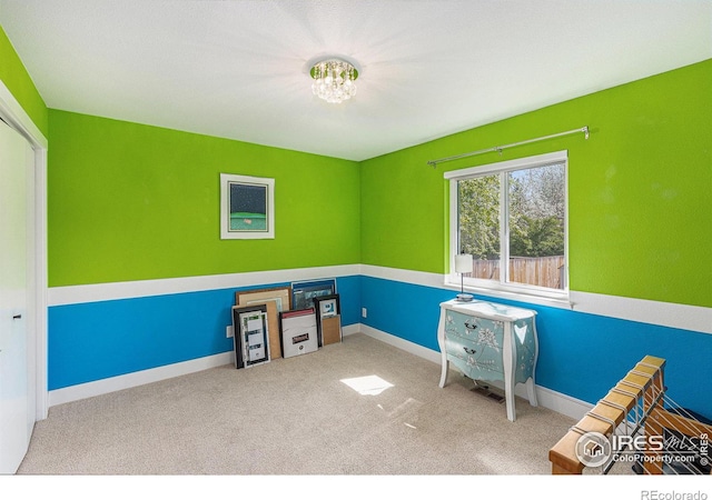 2310 44th Ave, Greeley, CO 80634 - playroom with carpet floors, baseboards, and a chandelier