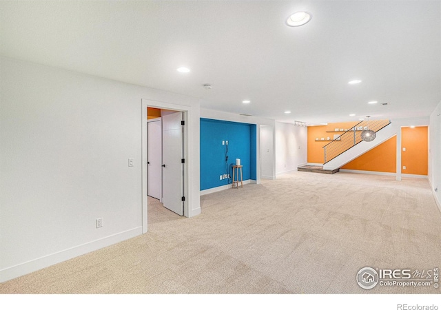 2310 44th Ave, Greeley, CO 80634 - basement featuring carpet, recessed lighting, stairs, and baseboards
