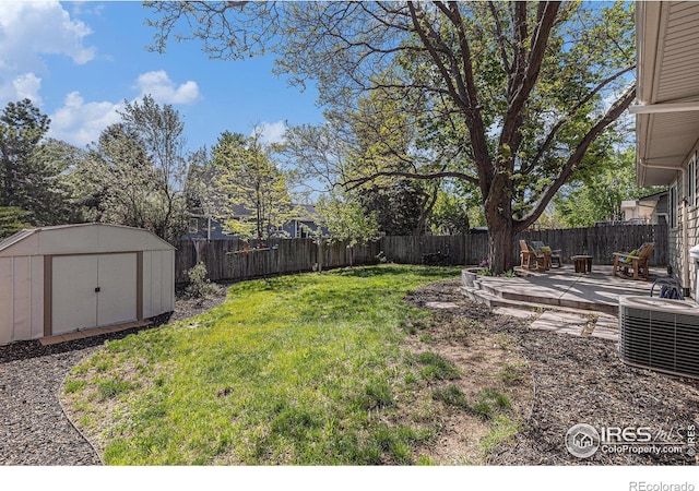 2310 44th Ave, Greeley, CO 80634 - view of yard with a storage unit, an outbuilding, a patio area, and central AC unit